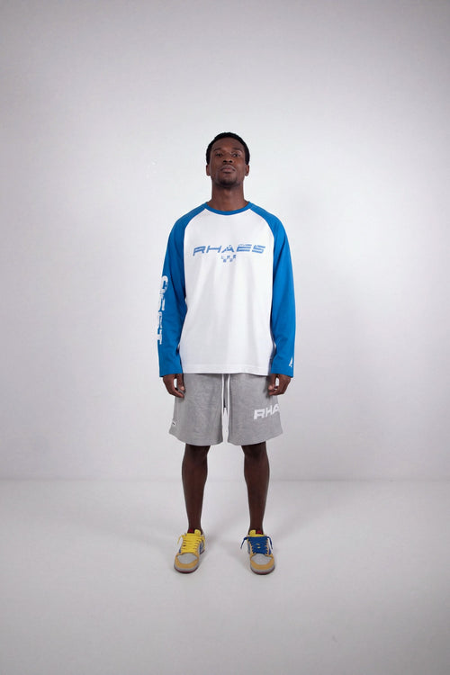 Model wearing RHAES 1995 Raglan Long Sleeve with RHAES Essential Shorts — full body