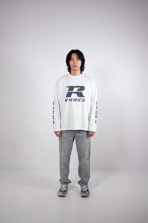Model wearing RHAES Racing Long Sleeve in White — full body front