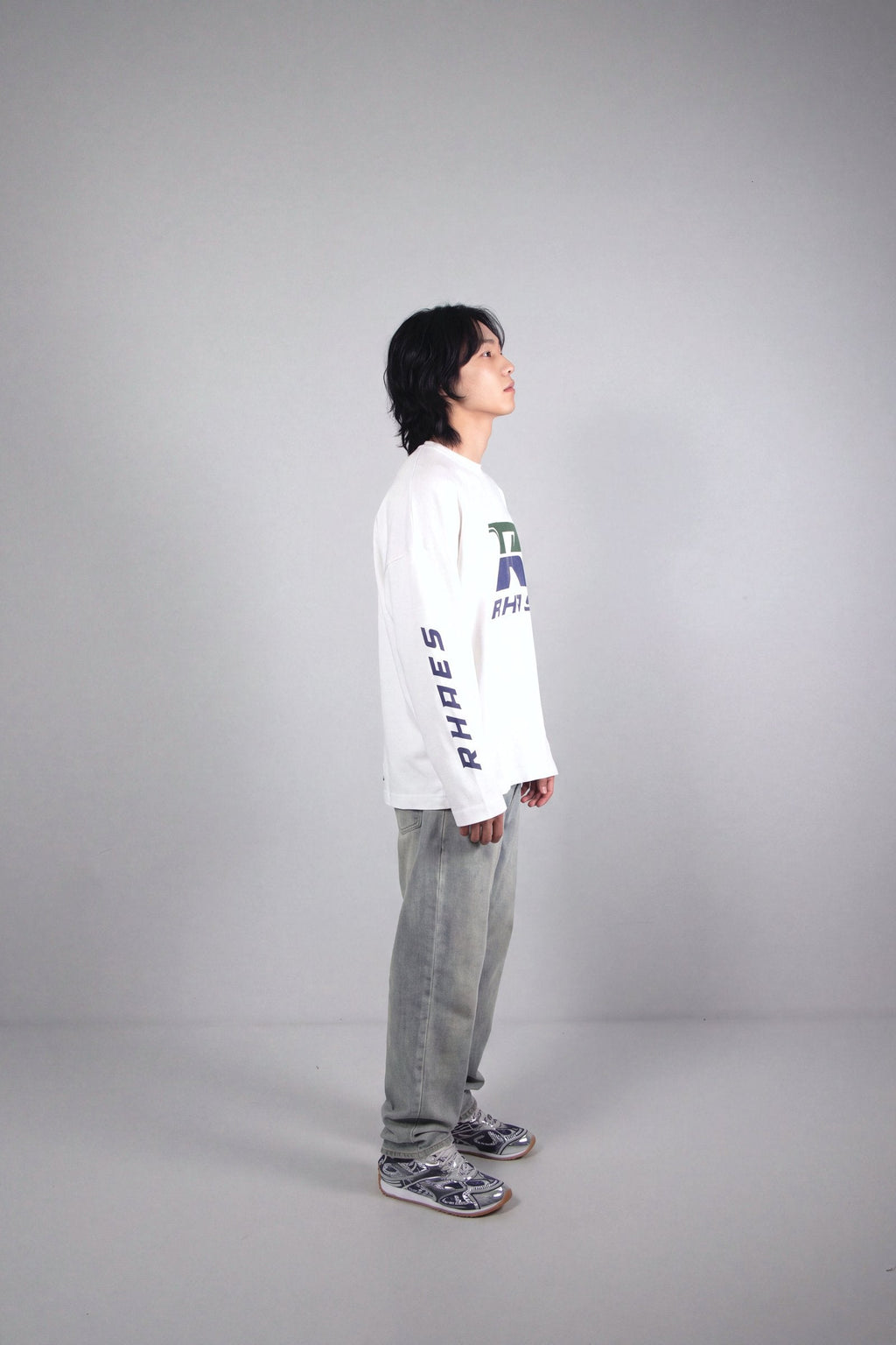 RHAES Racing Long Sleeve in White — side profile with RHAES sleeve print