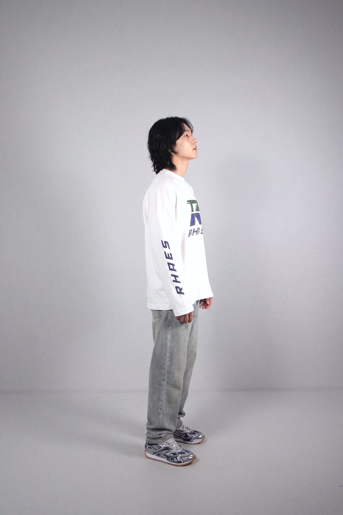RHAES Racing Long Sleeve in White — side profile with RHAES sleeve print