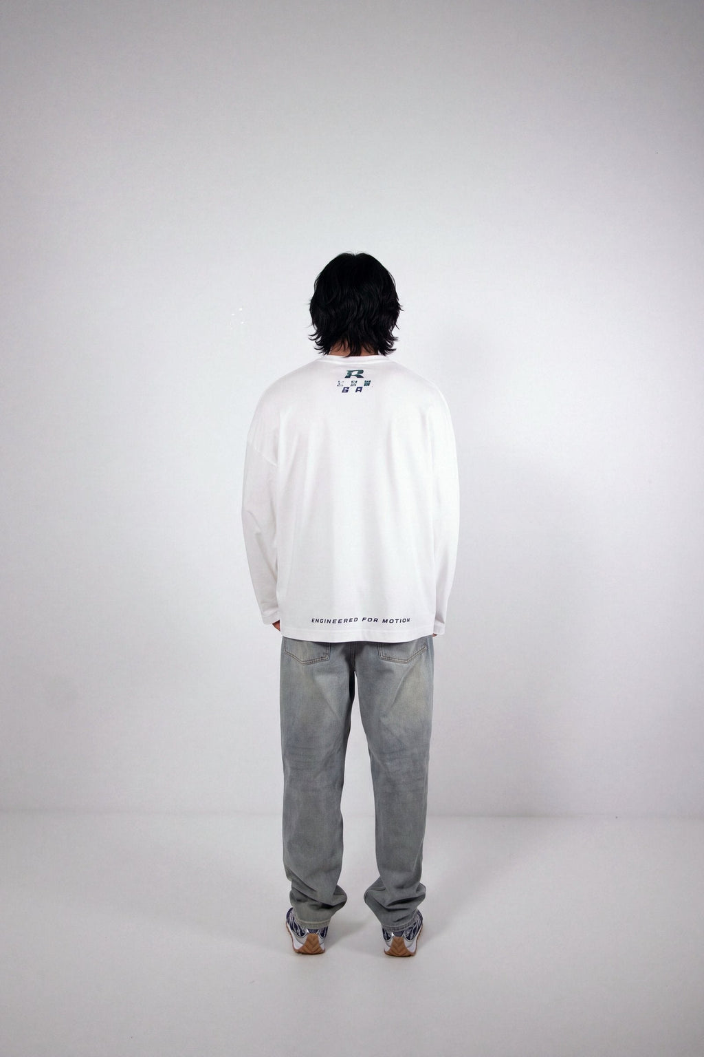 RHAES Racing Long Sleeve in White — back with Engineered for Motion print