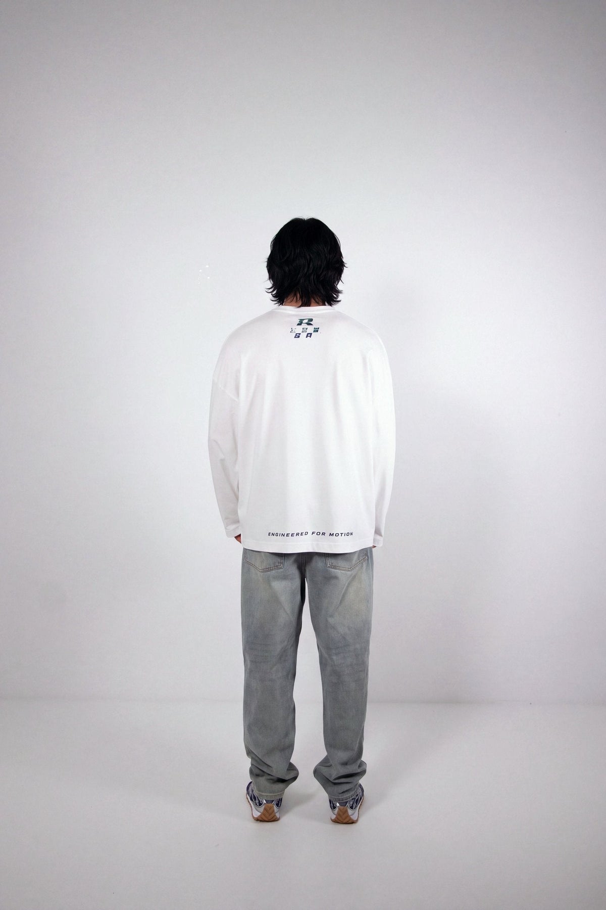 RHAES Racing Long Sleeve in White — back with Engineered for Motion print