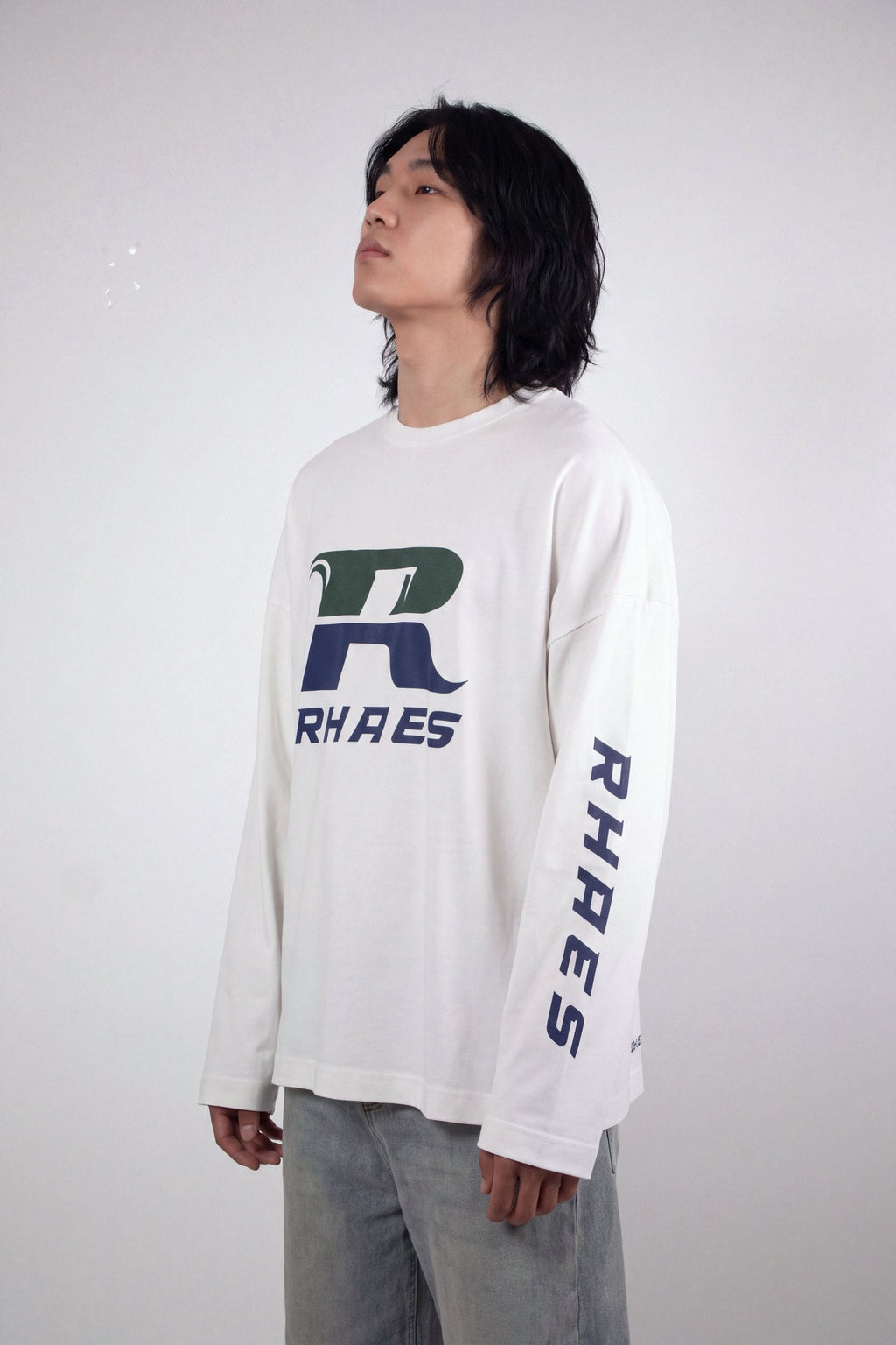 RHAES Racing Long Sleeve in White — three-quarter view with sleeve lettering